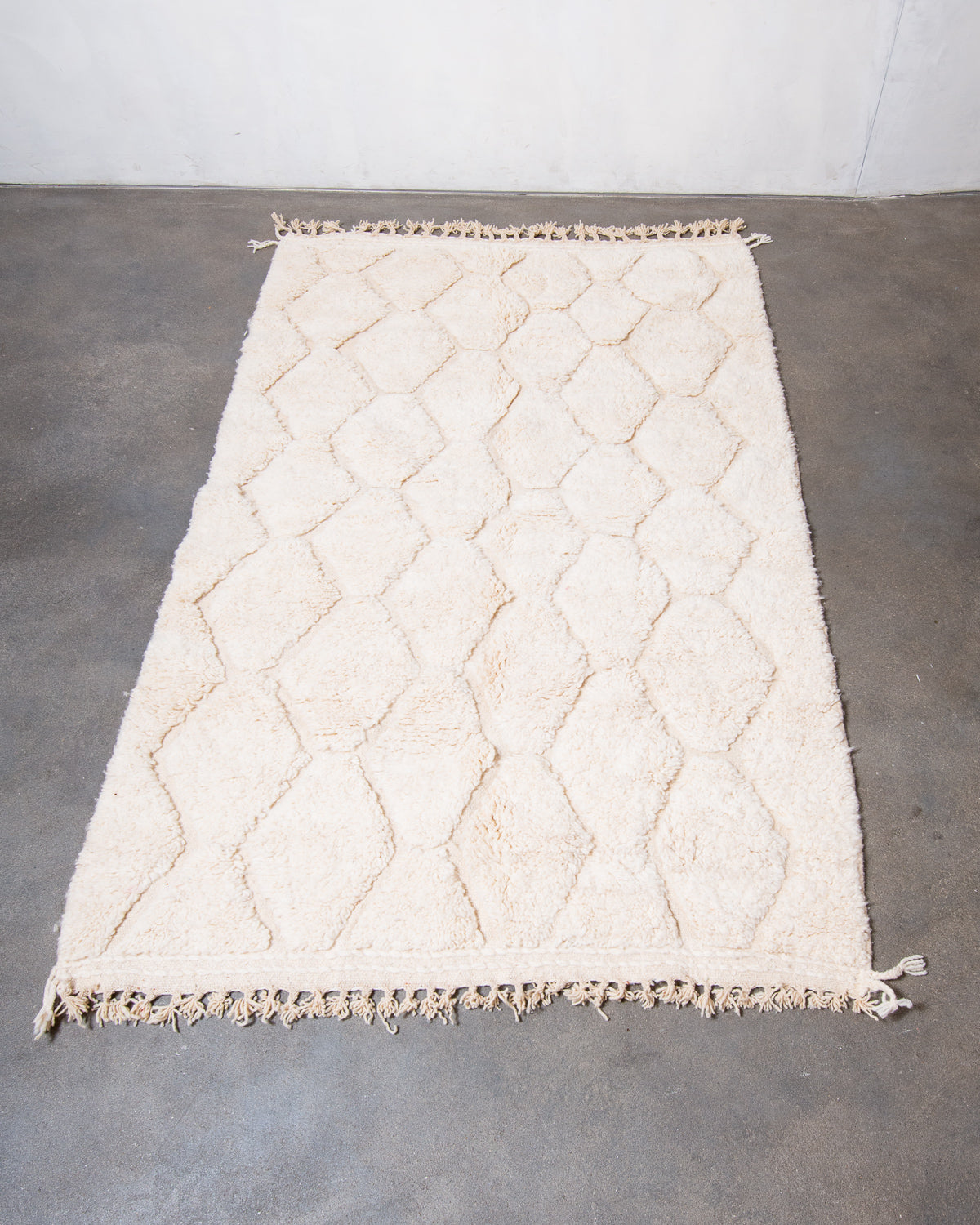 Modern, designer, handcrafted Berber rug from Morocco. Beniourain carpet with minimalist design, natural wool pile and a fluffy texture.